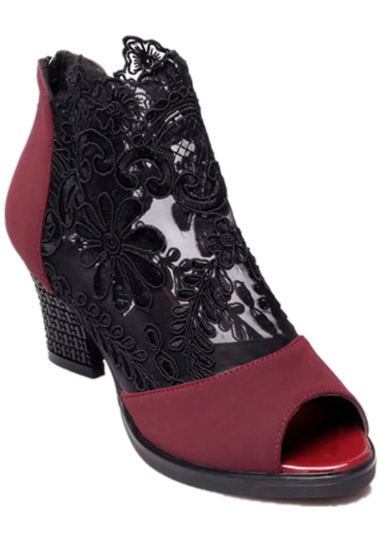 Black women's lace-up gladiator sandals with a square heel and zip fastener.