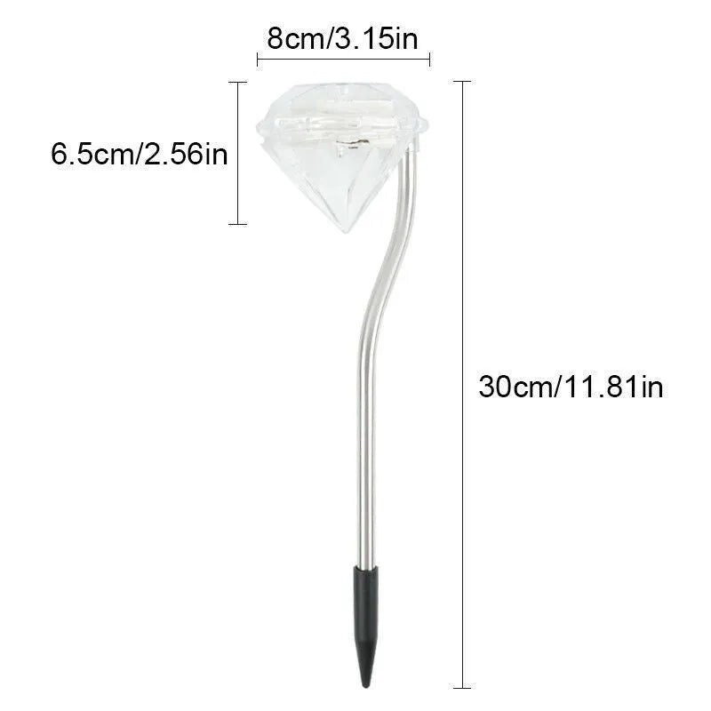Solar powered diamond-shaped garden spotlight with adjustable angle on a grassy lawn.