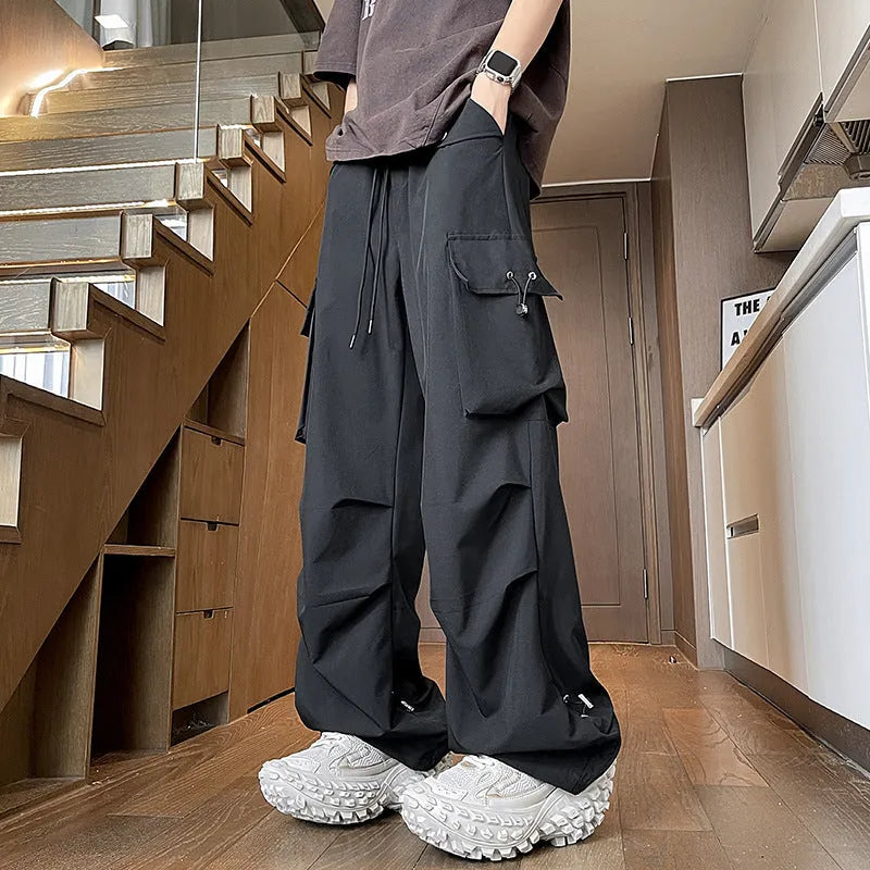 Plus size loose straight-leg waterproof trousers in black, available in sizes M to 5XL.