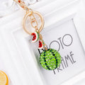 Green zinc alloy keychain shaped like a watermelon, measuring 12cm in length.