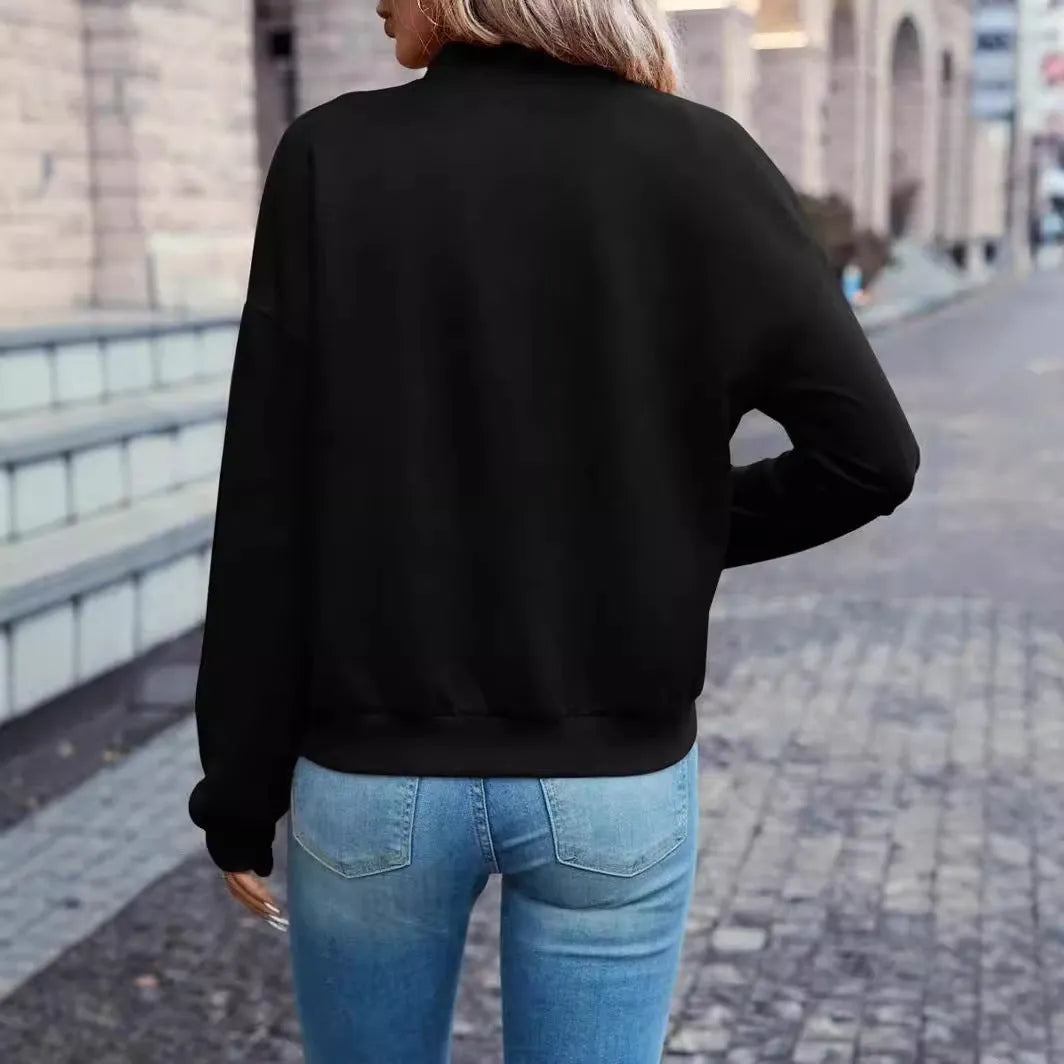 Black women's casual long sleeve zip jacket with faux pocket detailing on a model