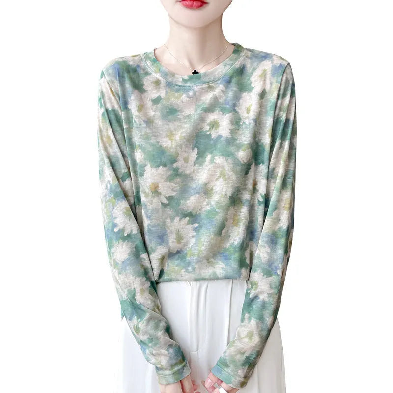 Women's round neck floral print pullover top in Tencel cotton fabric on a hanger.