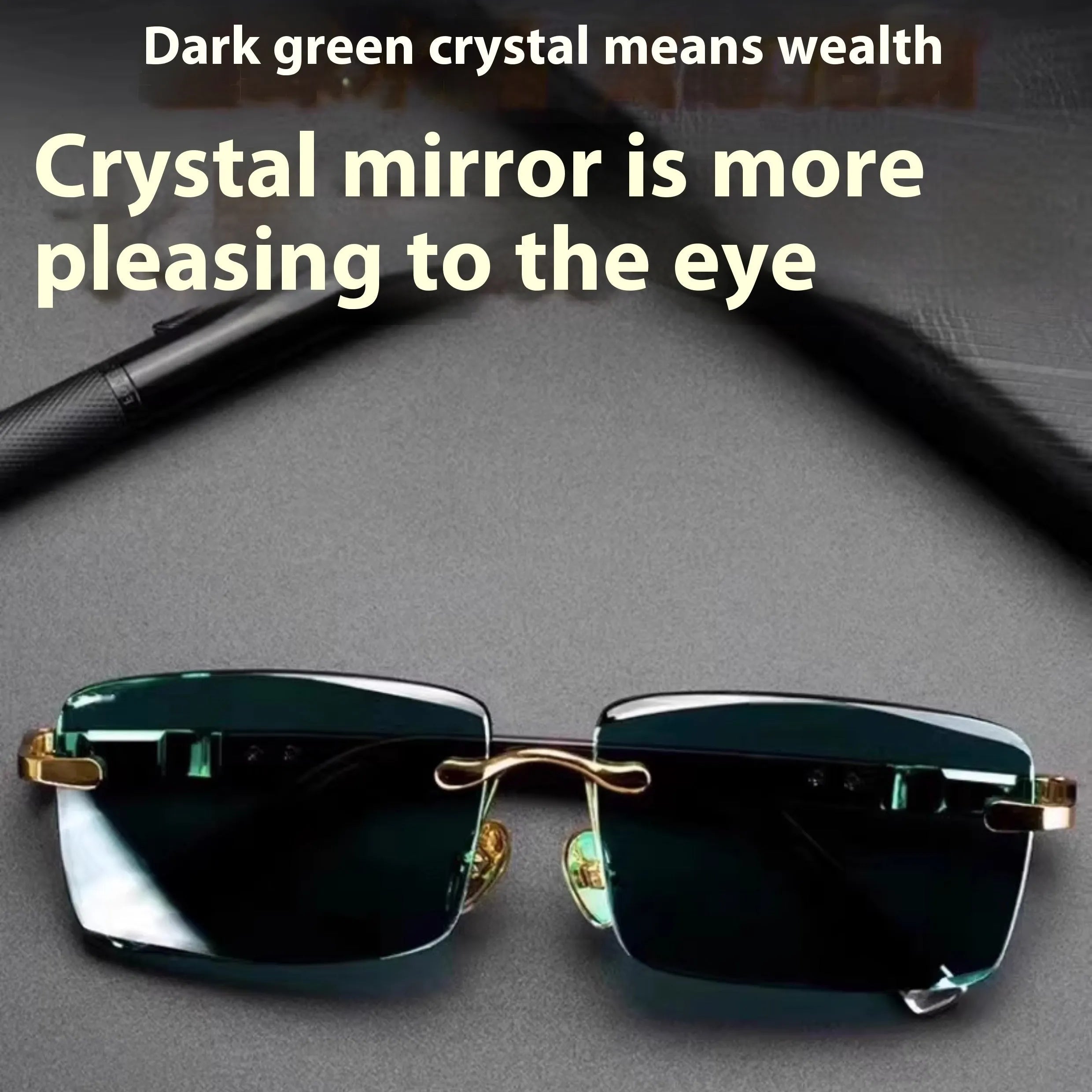 A pair of frameless dark green crystal sunglasses with a hard case and lens cloth.