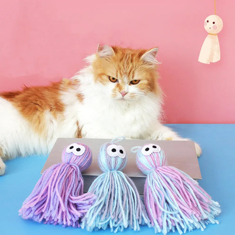 Cat toy set with four compressed wool balls and hanging teaser stick in blue grey colour combination