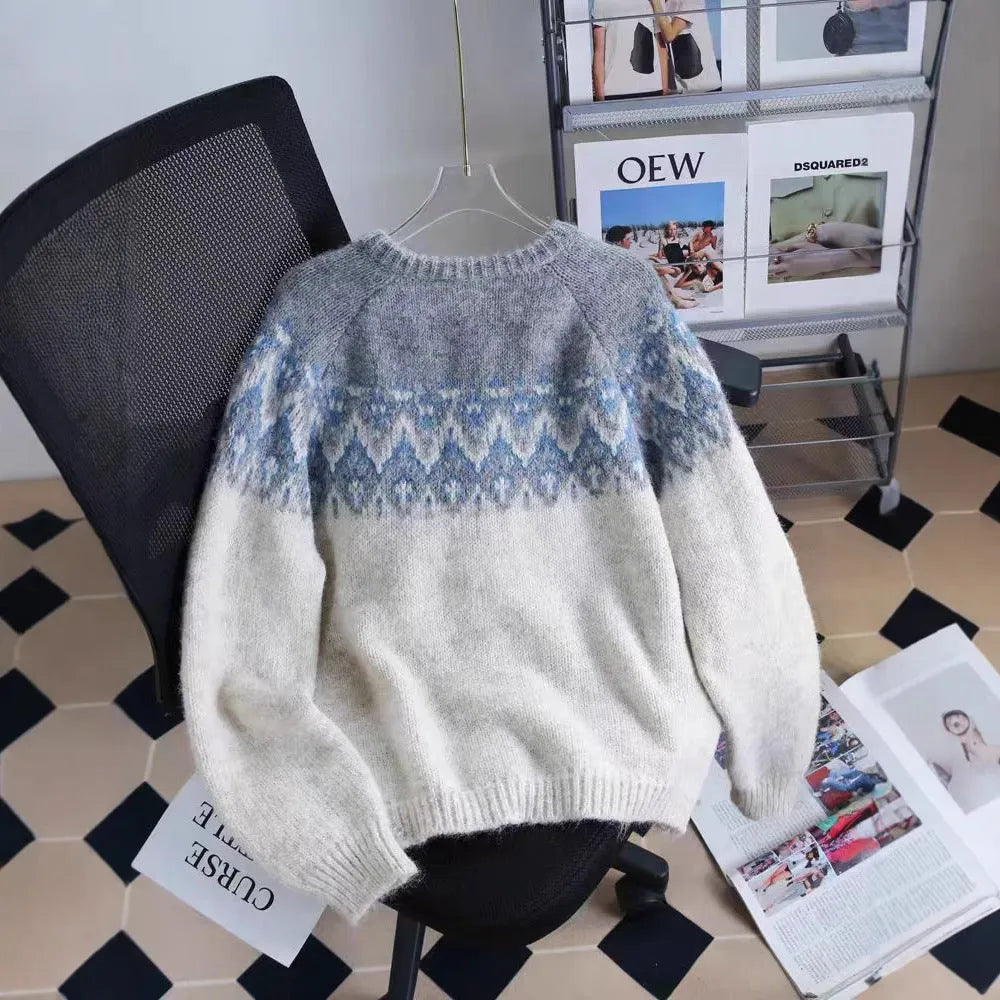 Women's loose-fit jacquard sweater coat in milky white, shown with long sleeves and a textured pattern.