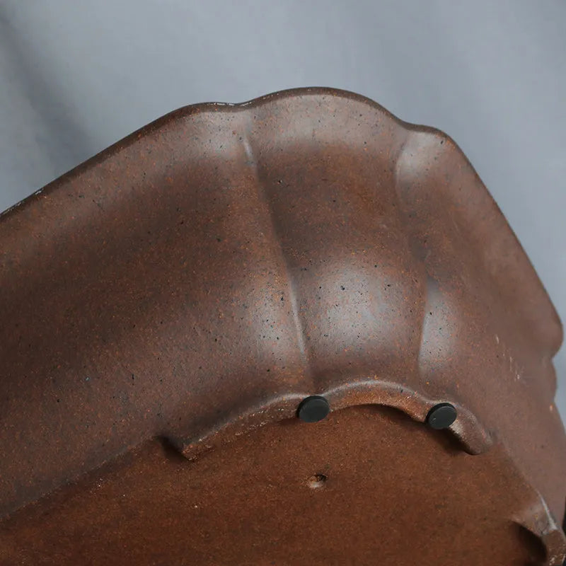 A modern rectangular flower pot made from purple sand ceramic, standing on a floor.