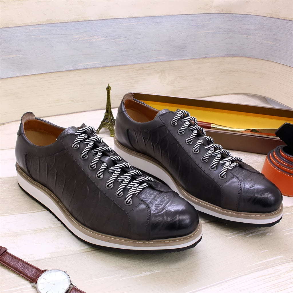 Men's low-top handmade shoes with an embossed pattern, shown in multiple colours with front lace-up detail.