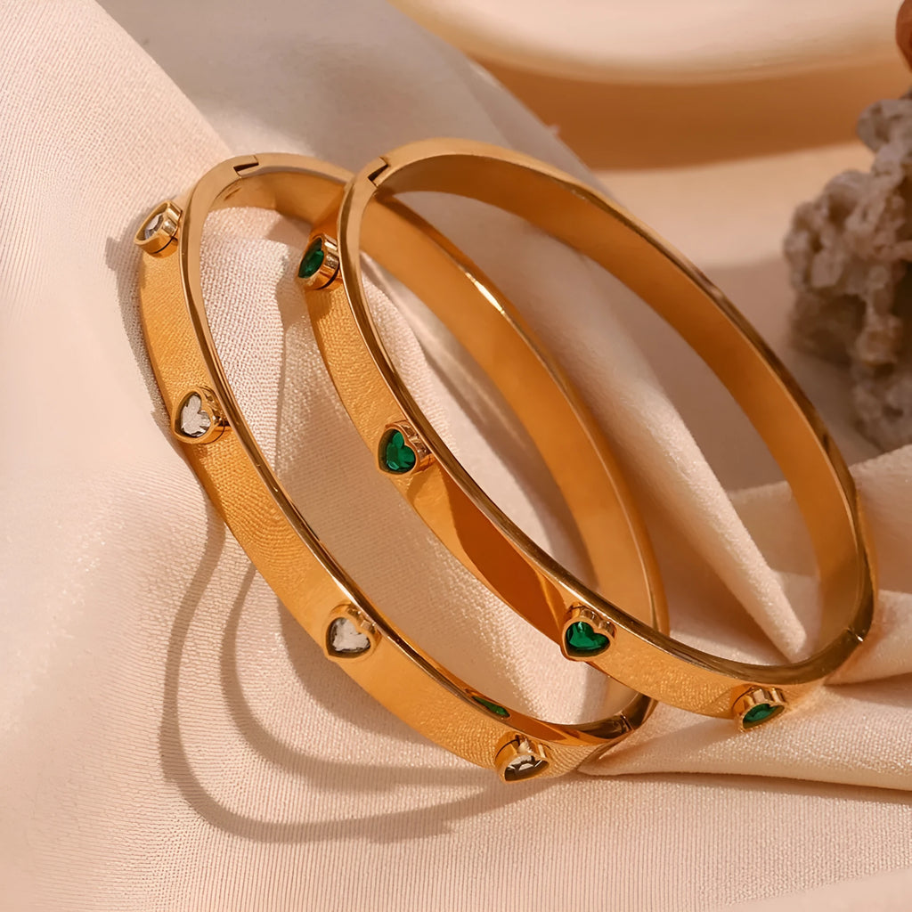 Stainless steel bracelet with peach heart centrepiece and micro-inlaid detailing in golden finish