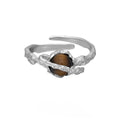 Women's Saturn design open ring with adjustable silver band and tigereye stone detail