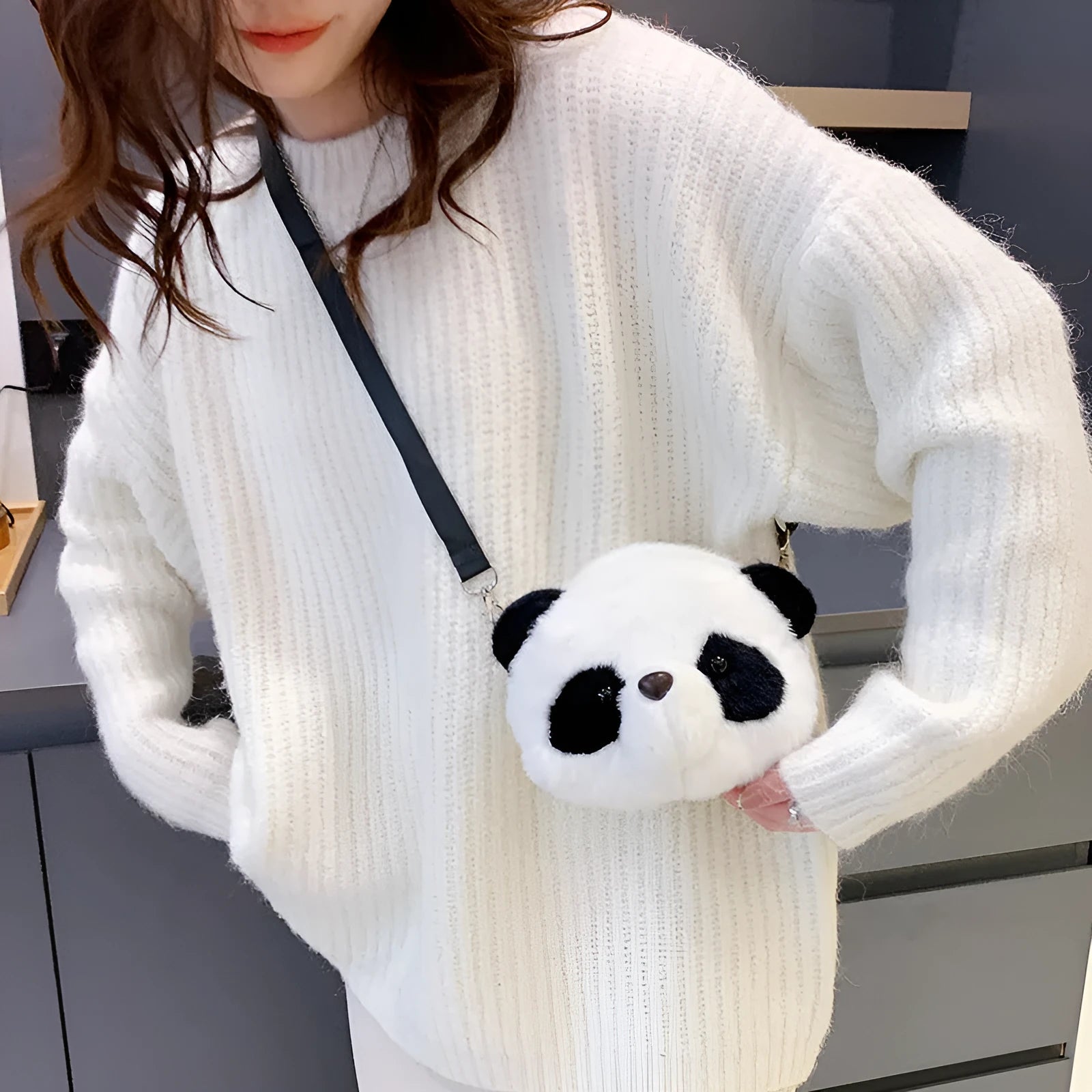 Plush panda head design cylindrical crossbody bag measuring 18cm wide