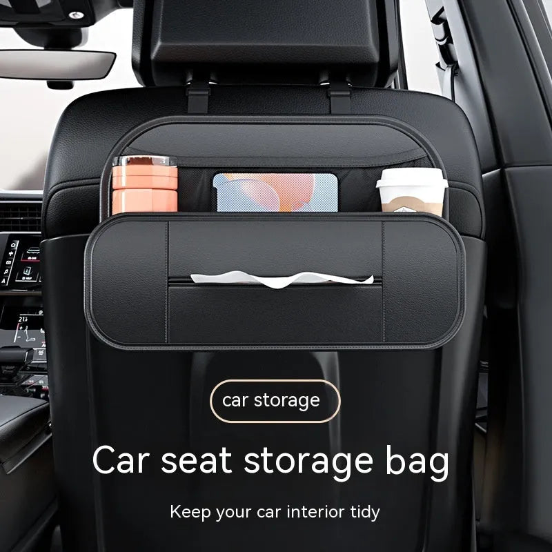 Black leather car seat rear storage bag showing its box shape and size against a vehicle seat.