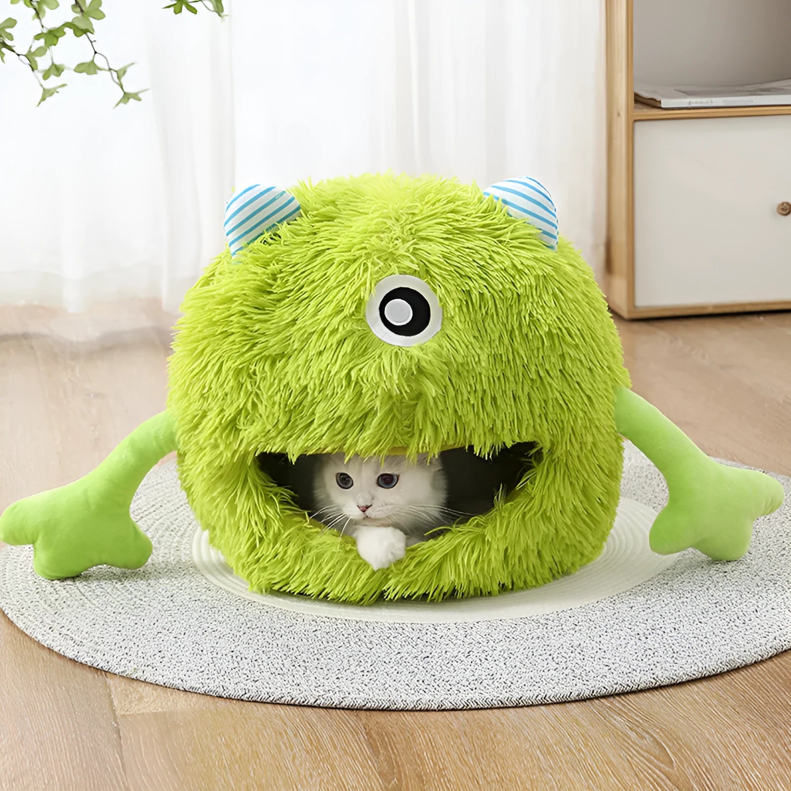 Round fluffy cat bed with soft plush surface and non-slip base