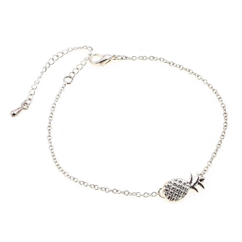 Gold and silver alloy pineapple charm bracelets on a white background.