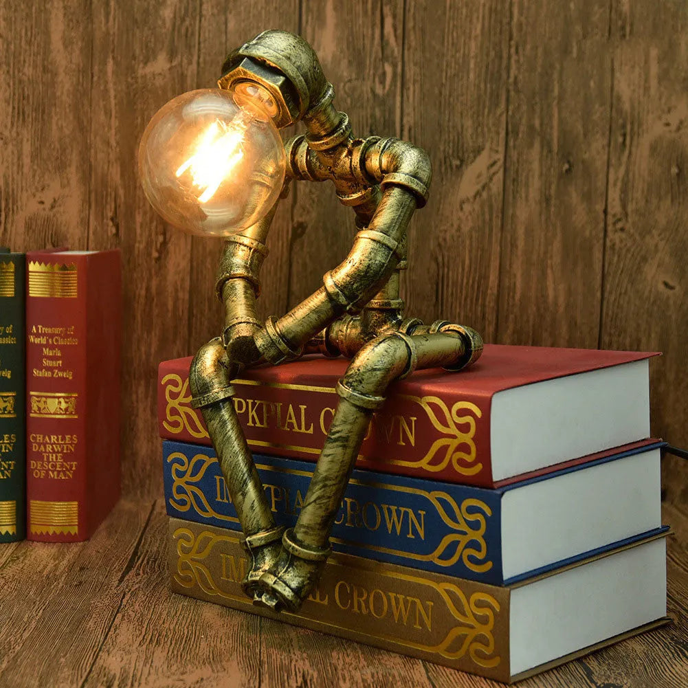 Green bronze industrial desk lamp with iron pipe design on wooden table