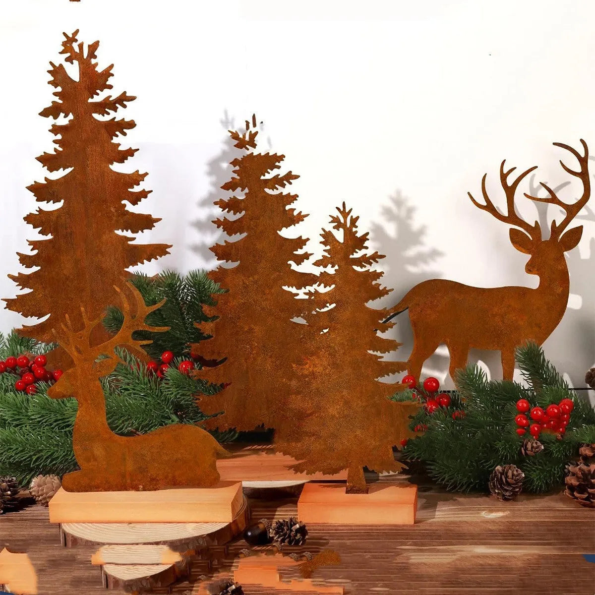Three rusty metal Christmas tree decorations with elk silhouette cutouts