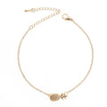 Gold and silver alloy pineapple charm bracelets on a white background.