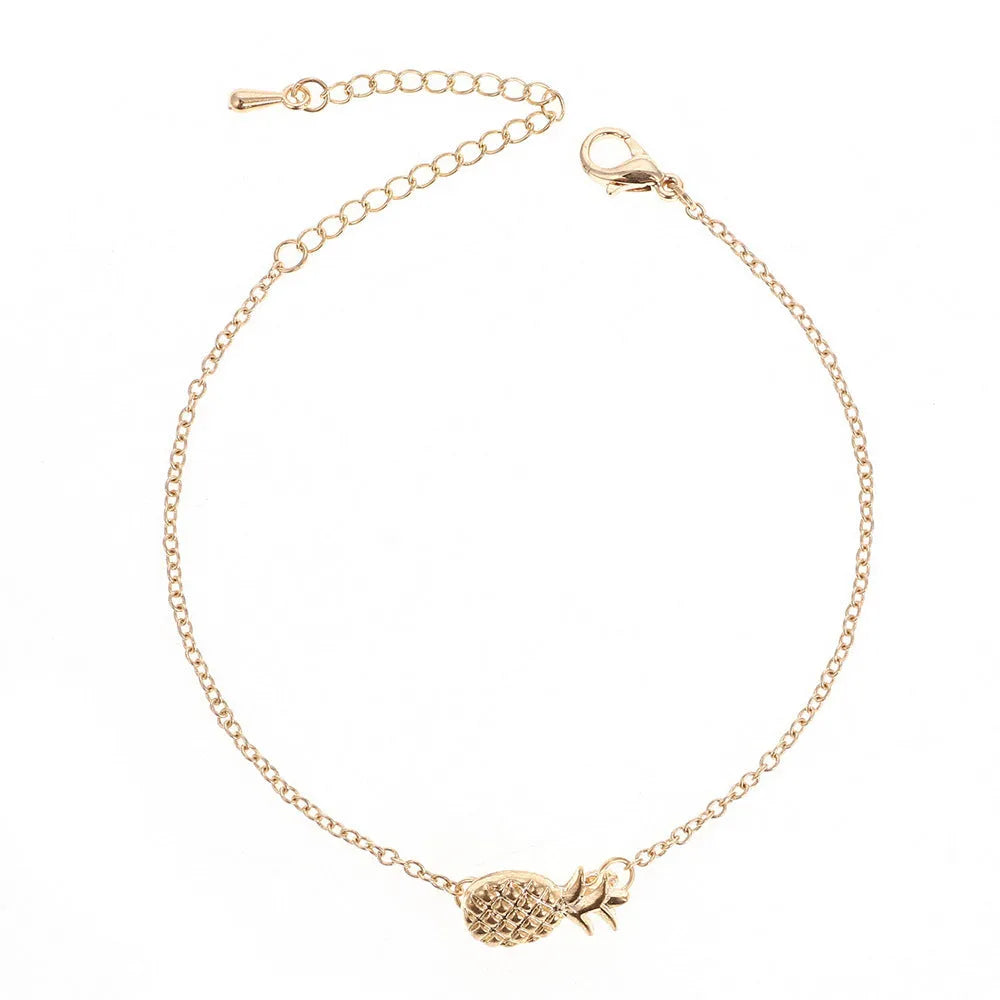 Gold and silver alloy pineapple charm bracelets on a white background.
