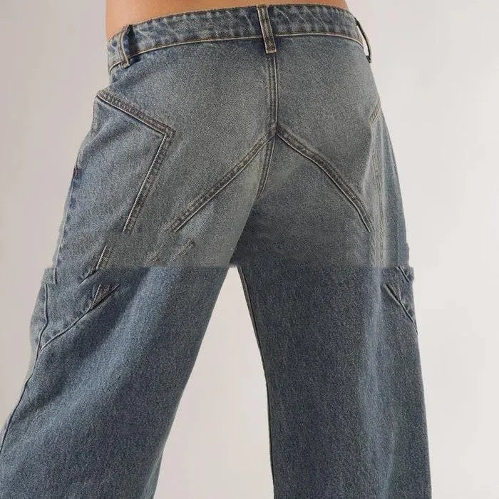 Women's blue cotton wide leg mop trousers with low waist and splicing detail laid flat.