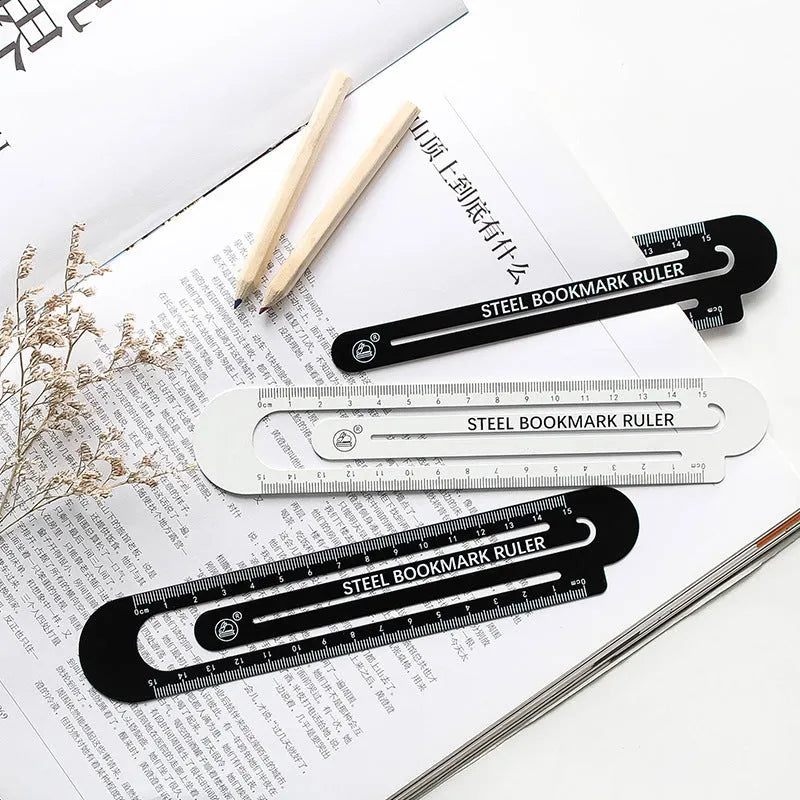 Black and white two-sided ruler 12cm long on white surface
