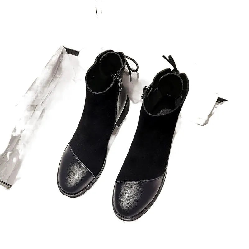 Black women's knee-high Martin boots with side zipper and round toe.