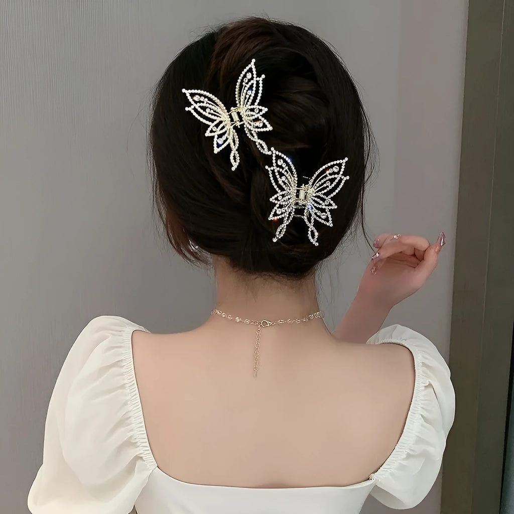 Women's butterfly-shaped alloy hair clip in rhinestone or pearl style, measuring 6.7 cm.