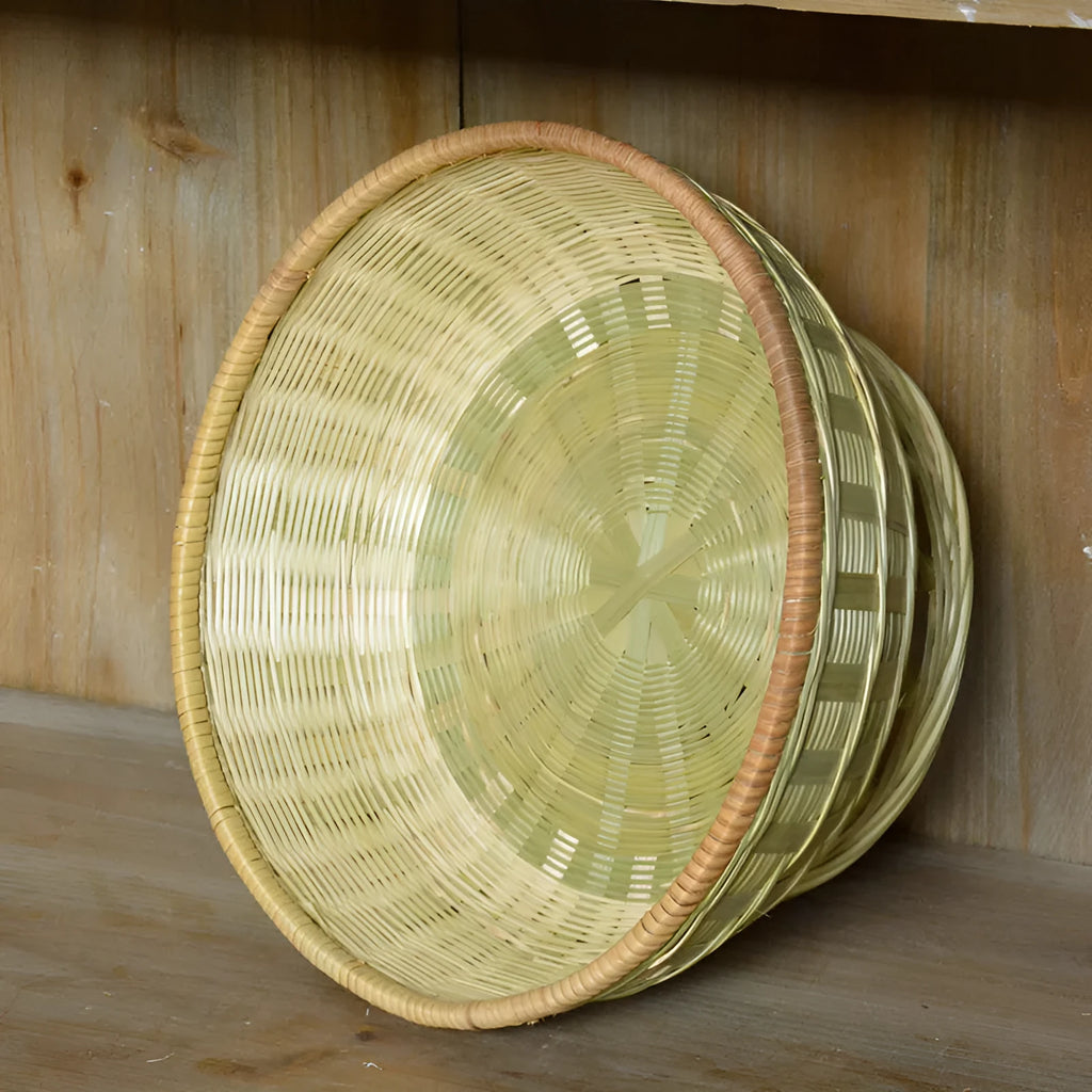 Handwoven natural bamboo storage basket showing three size variations