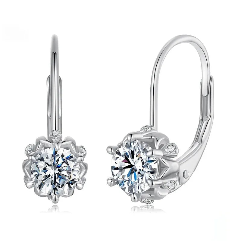 Close-up of a sterling silver floral bud ear clip with a moissanite stone and white gold plating.