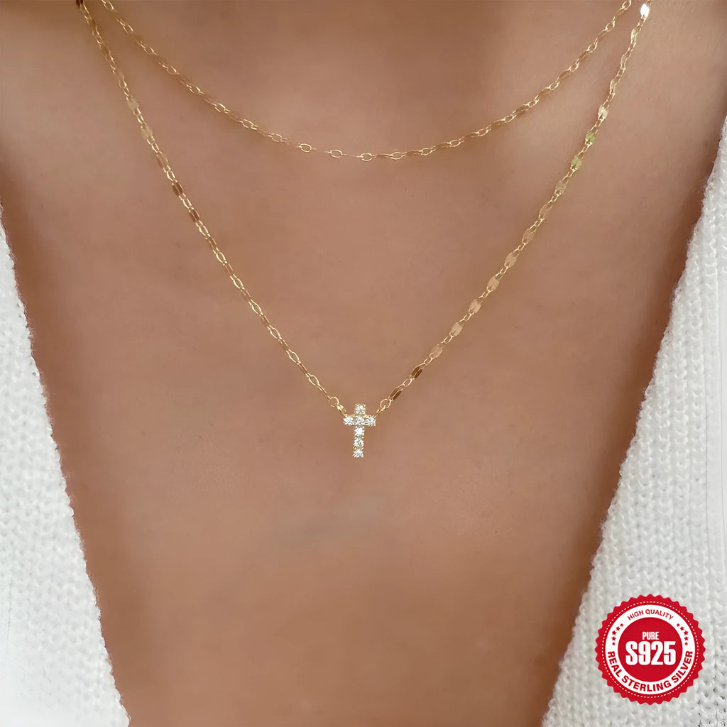 Sterling silver double layer twin diamond cross pendant on a clavicle chain.