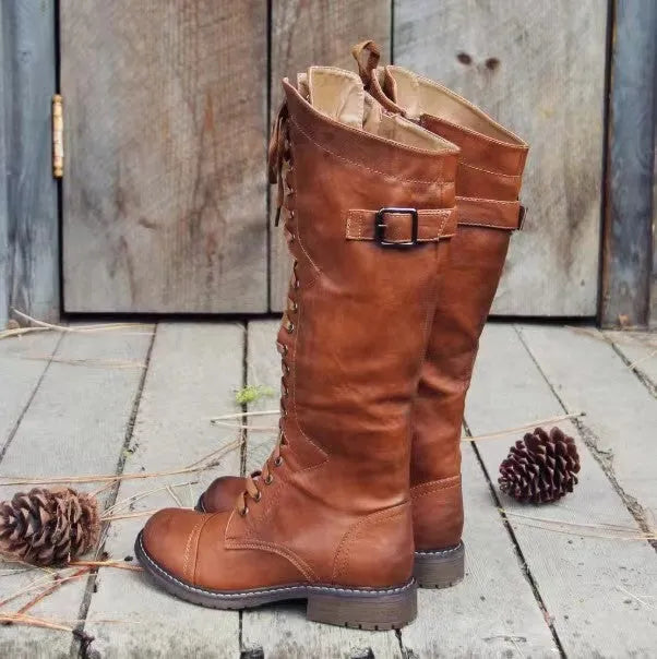 Women's black chunky heel high-leg casual boots with a round toe and rubber sole.