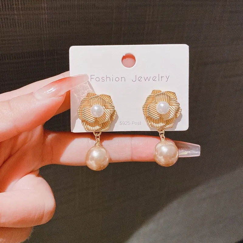 Gold alloy opal flower stud earrings with needle rose and pearl design Hong Kong style