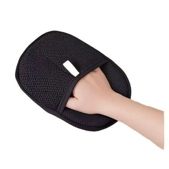 Black pet hair remover glove with silicone bristles for deshedding dogs and cats.