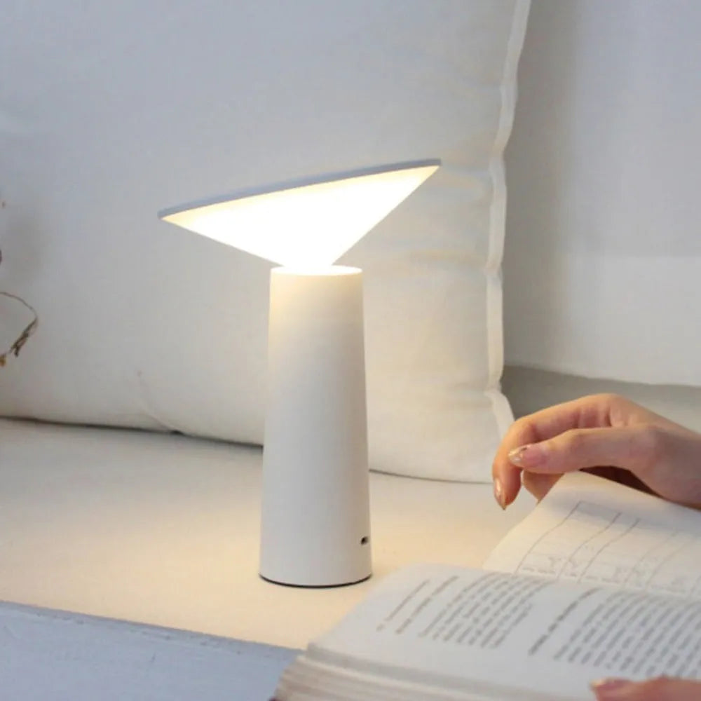 Black USB touch control desk lamp with adjustable head on a wooden desk