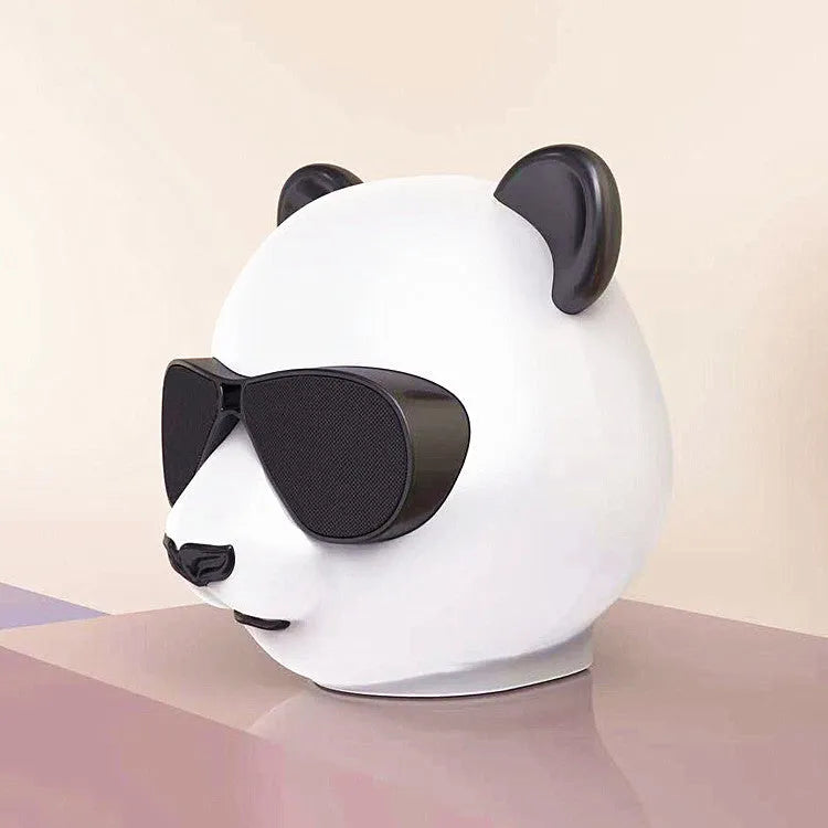 Portable mini Bluetooth speaker in classic style showing front grille and compact size.