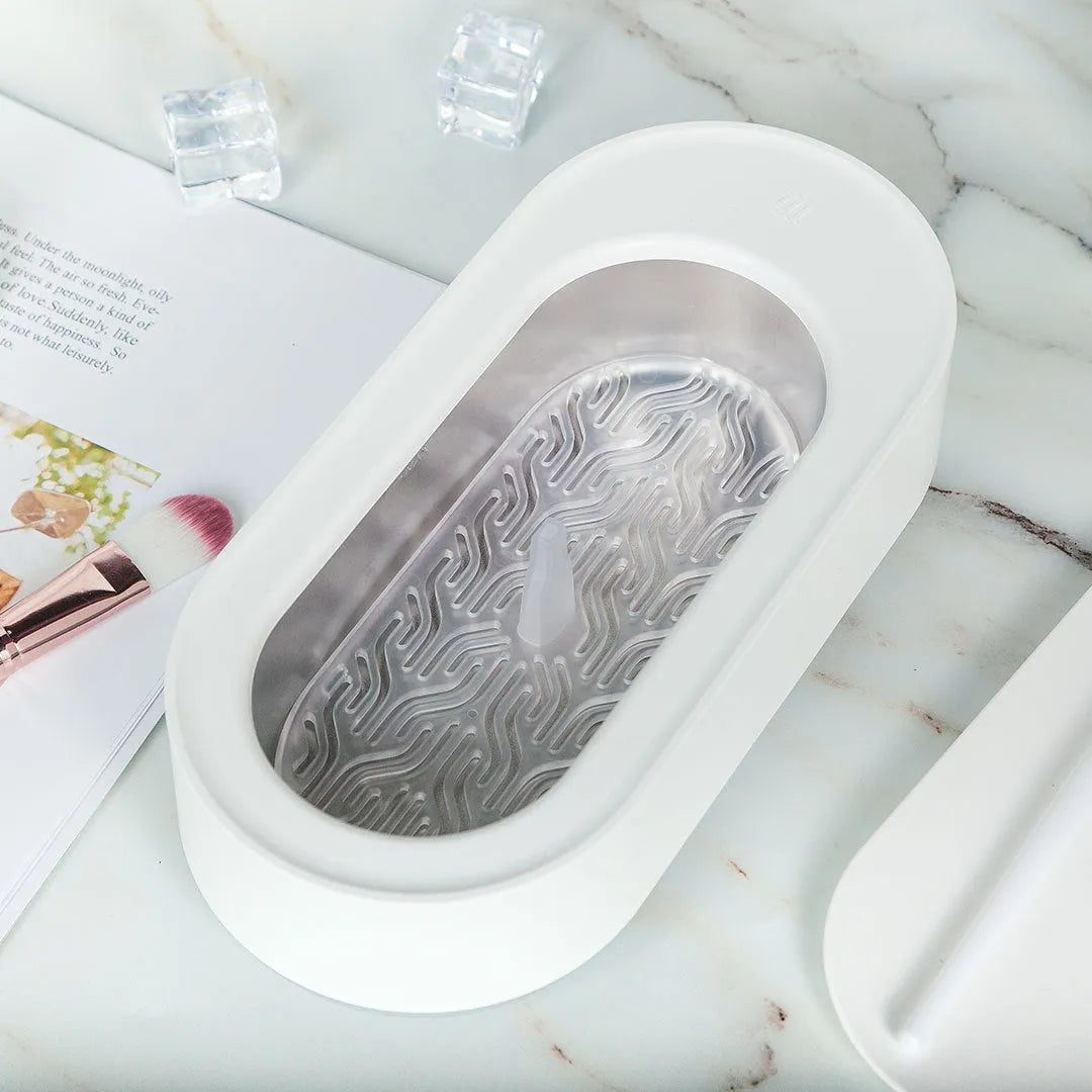 White portable ultrasonic cleaning machine with touch button and stainless steel tank.