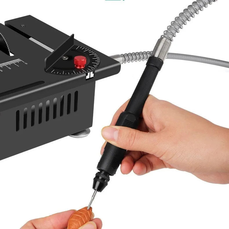 Compact lithium-ion cordless micro desktop saw with metal housing on a workbench.