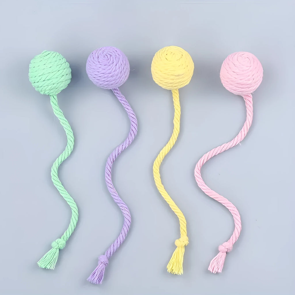 Colourful cat toy ball with an attached rope, shown in green, pink, purple, and yellow with 6cm and 3cm size options.
