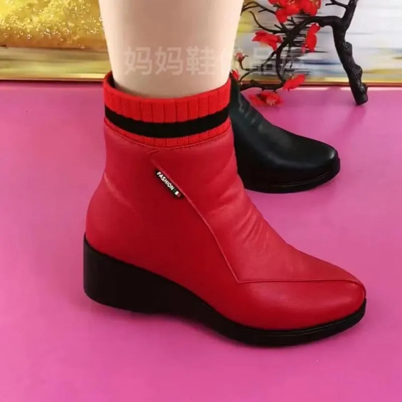 Women's soft leather ankle boots with mid heel, side zipper, and square heel in black
