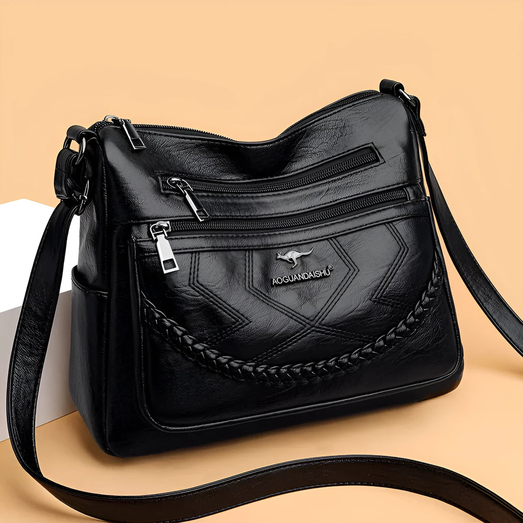 Soft PU leather shoulder bag in horizontal square shape with crossbody strap and multiple compartments