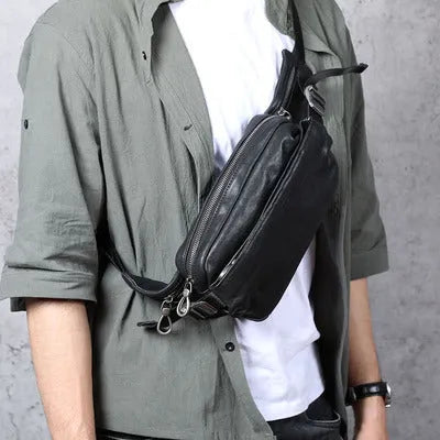 Men's small black head layer cowhide cross-body backpack with zip closure and single shoulder strap