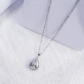 Women's rose gold drop shape necklace with rhinestone details on an alloy chain.