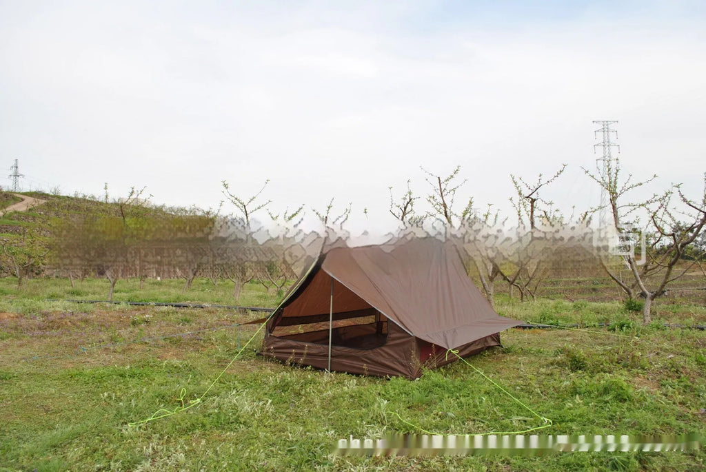 Brown A-frame hiking tent supported by hiking poles showing spacious interior for 2-3 campers