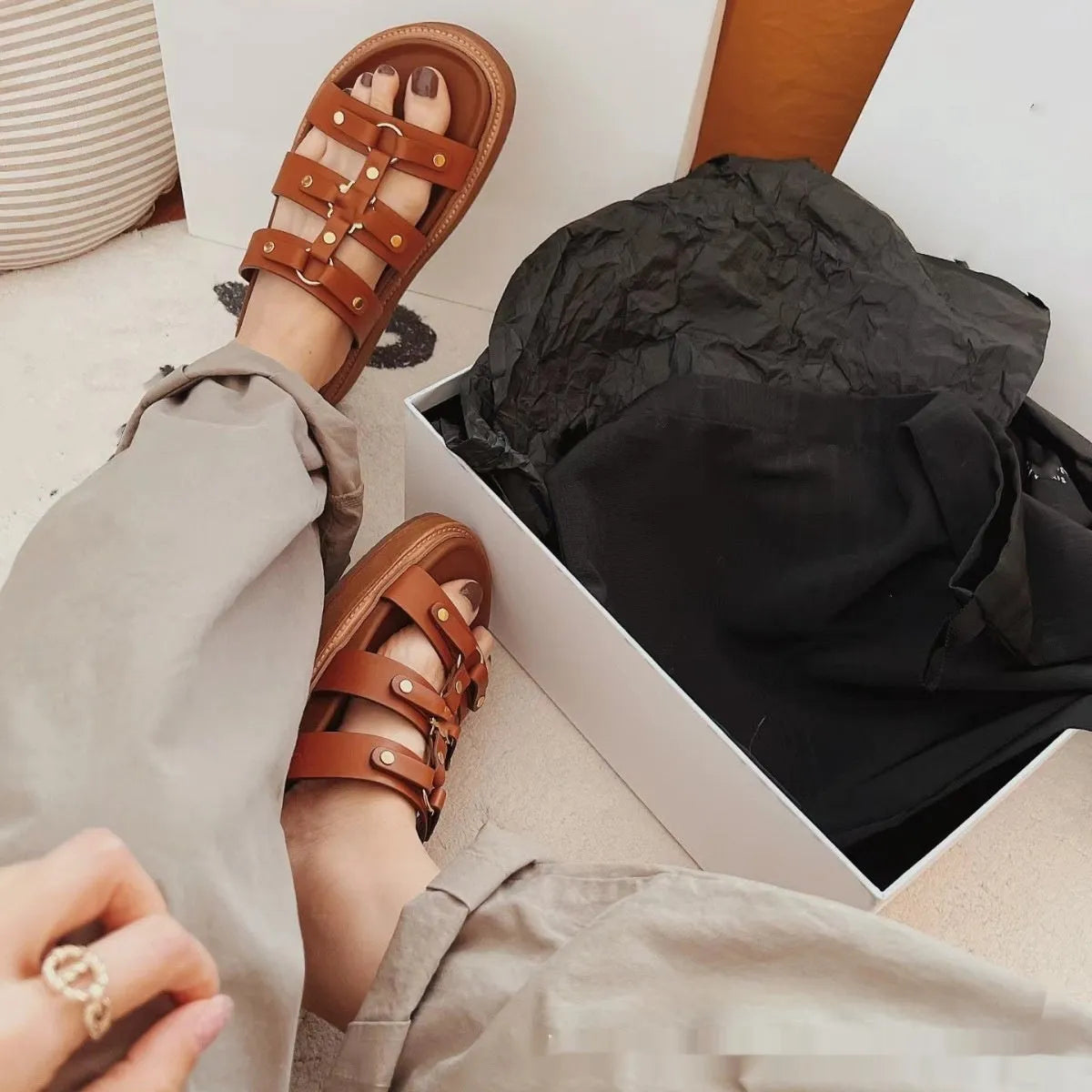 Women's Roman style sandal slippers in patent leather finish with sheepskin upper