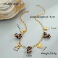 Stainless steel necklace with geometric pendant showing leopard spots, love hearts and flowers in gold finish
