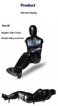 Black patent leather bondage set showing full body wrap and six ratchet tie-down straps