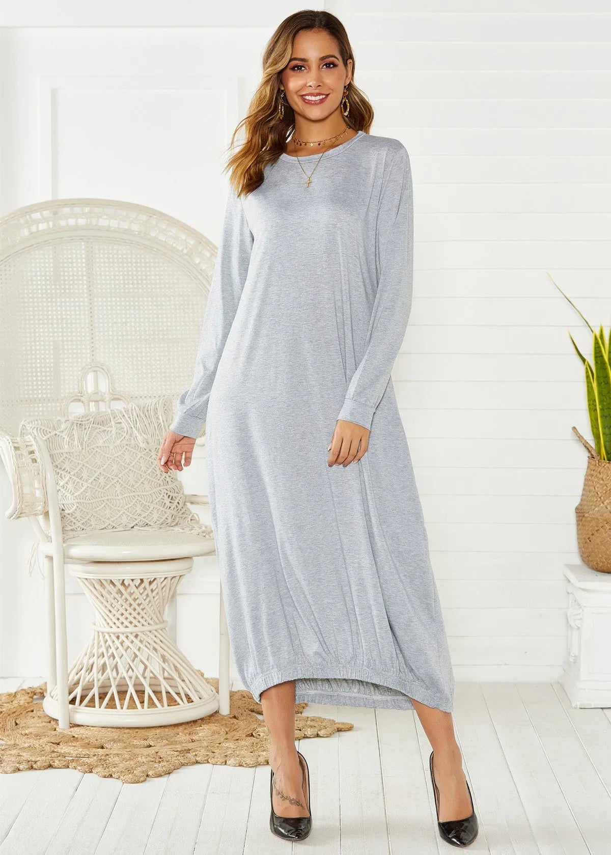 Black loose-fitting lantern dress with lace-up crew neck and ruffle detail