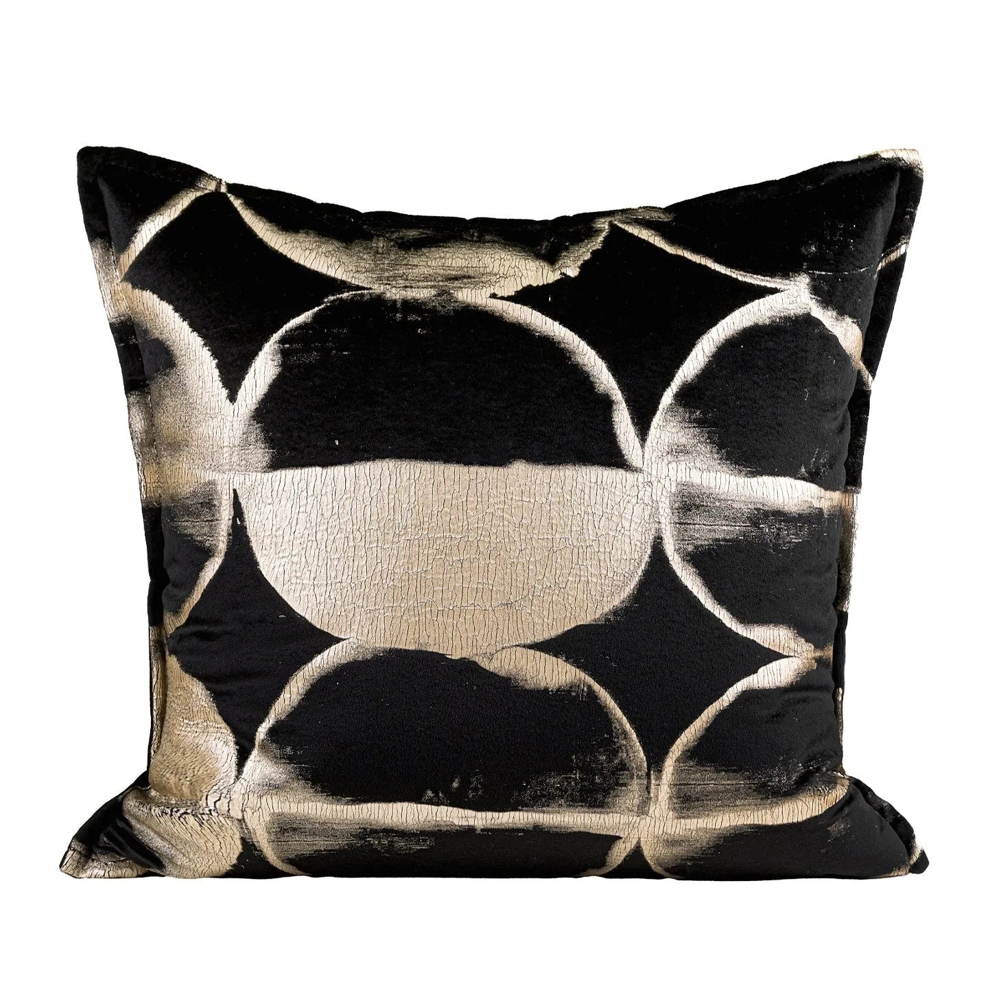 Black gold abstract patterned flannel decorative cushion on a sofa.