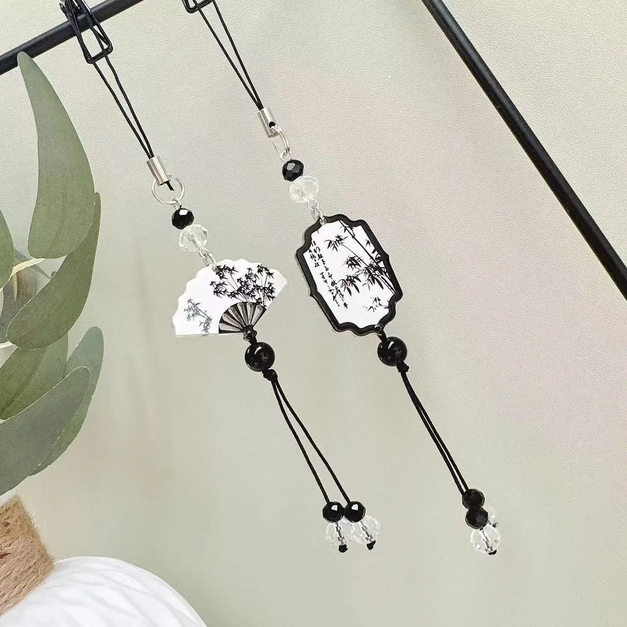Chinese style floral pendant keychain with glossy baked varnish finish on a bead base