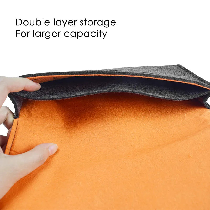 Black felt carrying pouch for Nintendo Switch open to show console compartment and game card slots