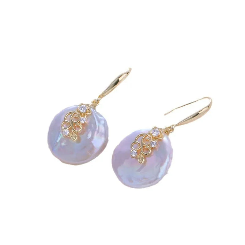 Women's matching baroque pearl geometry necklace with O-ring chain and earring set on display