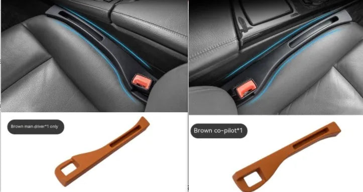 Black plastic car seat gap storage box with handle inserted between vehicle front seats.